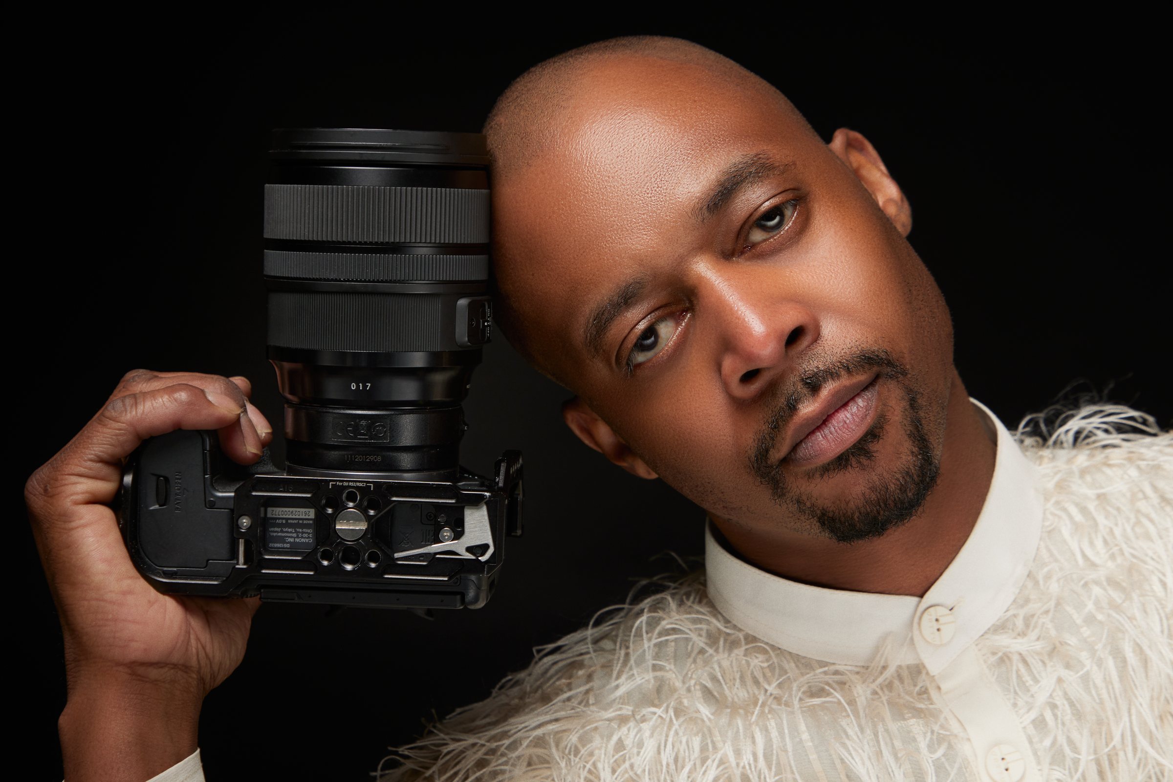 Skyye Kimmons holding his camera, photographed by Blake Martin