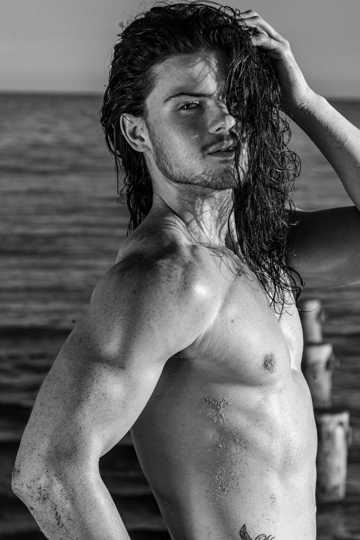 Black and white beach portrait with wet hair